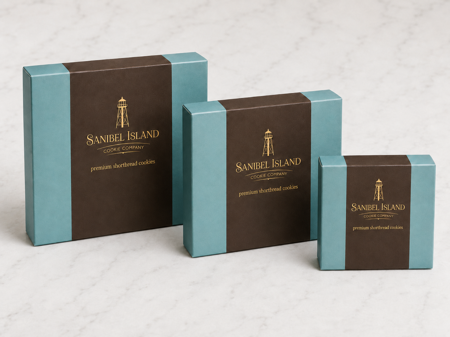 Large, medium, and small Sanibel Island Cookie Company gift boxes shown together